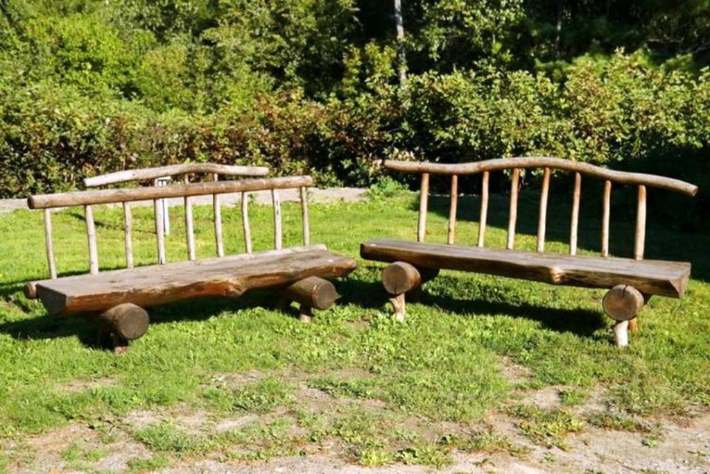 PAIR OF NATIVE AMERICAN MADE RUSTIC OUTDOOR BENCHES via Invaluable