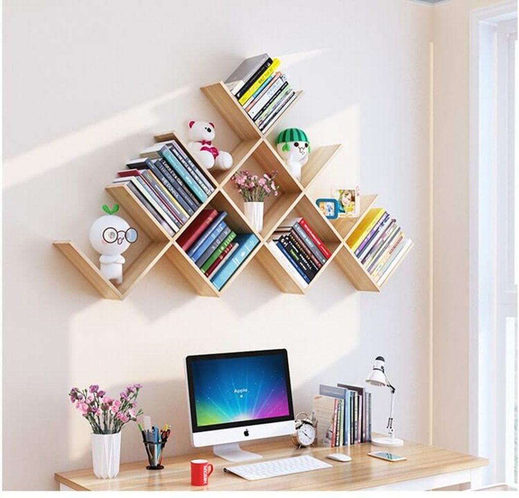 Wall mounted bookshelf above desk 