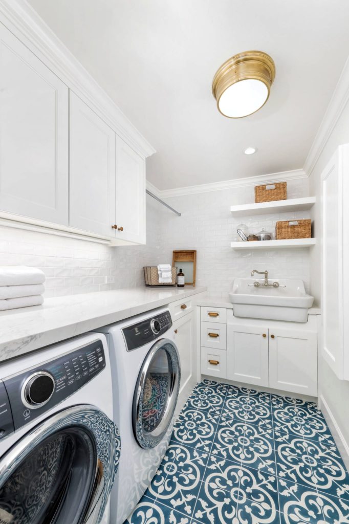 Farmhouse Style Laundry Room Featuring Navy Patterned Floor source Sitehouse