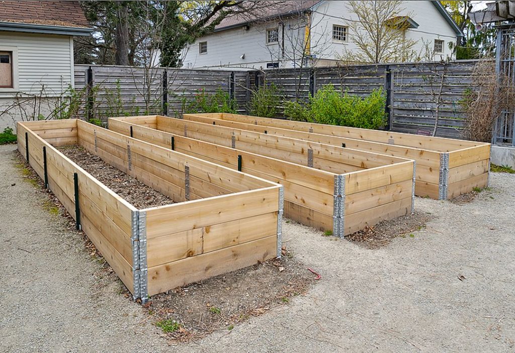 Logs raised Wooden Garden Bed via Harvest To Table